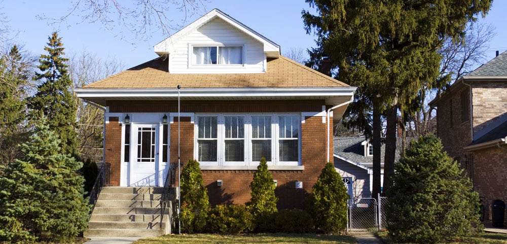 Exterior view of a nice, brown two-story home in Central Wisconsin.